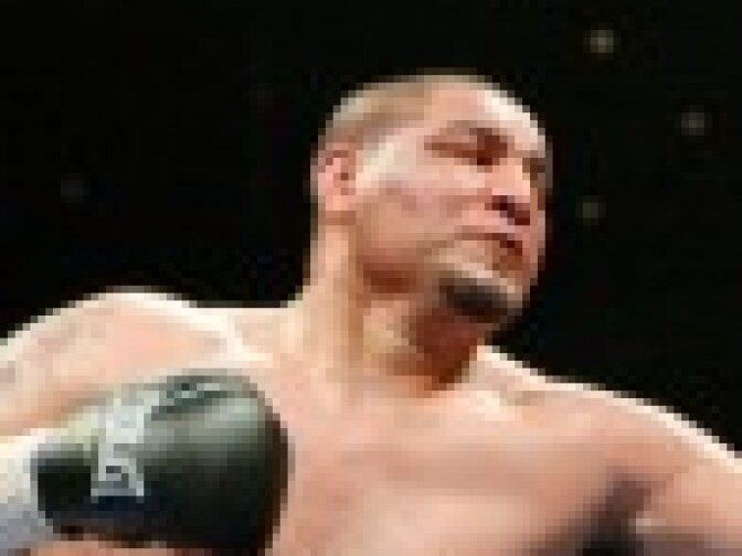 Chris Arreola (L) hits Jameel McCline in the fourth round of their heavyweight bout at the Mandalay Bay Events Center April 11, 2009 in Las Vegas, Nevada. Arreola won by knockout in the fourth round. (Photo by Ethan Miller/Getty Images) 
