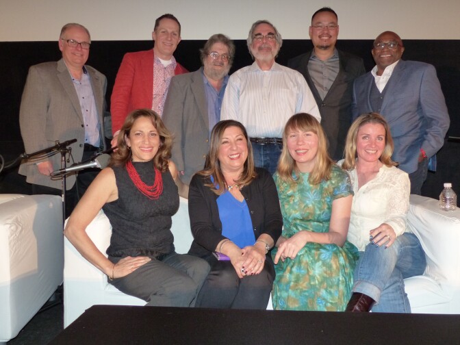 (L-R, First Row) Larry Mantle, Wade Major, Andy Klein, Charles Solomon, Justin Chang, Tim Cogshell (L-R, Second Row) Lael Loewenstein, Claudia Puig, Amy Nicholson and Christy Lemire pose for a photo at AirTalk's FilmWeek at the Egyptian 2016.