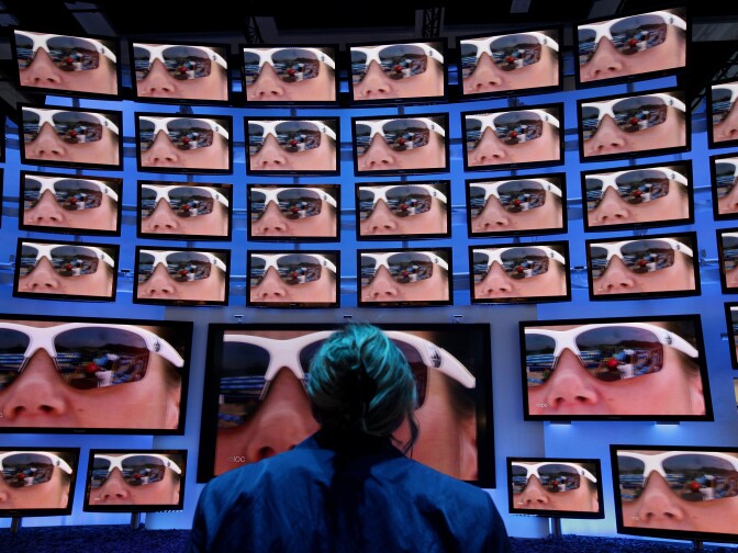 BERLIN - SEPTEMBER 02:  A woman looks at high-definition 3D television screens at Panasonic stand at the 2010 IFA technology and consumer electronics trade fair at Messe Berlin on September 2, 2010 in Berlin, Germany. The 2010 IFA will be open to the public from September 3-8.  (Photo by Sean Gallup/Getty Images)
