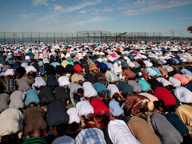 NEW YORK, NY - JUNE 25:  Muslims participate in a group prayer service during Eid al-Fitr, which marks the end of the Muslim holy month of Ramadan, in Bensonhurst Park in the Brooklyn borough June 25, 2017 in New York City. Muslims around the world are celebrating Eid al-Fitr, which means 'festival of breaking the fast' to mark the end of Ramadan. (Photo by Drew Angerer/Getty Images)