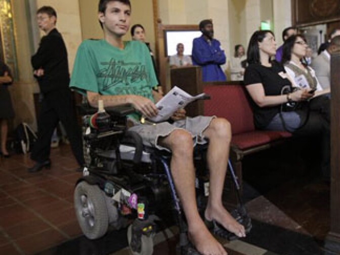 Michael Oliveri waits in his motorized wheelchair for his turn to speak on the regulation of marijuana for medical use in the city of Los Angeles, before the city council in council chambers at City Hall Wednesday, Nov. 18, 2009. 