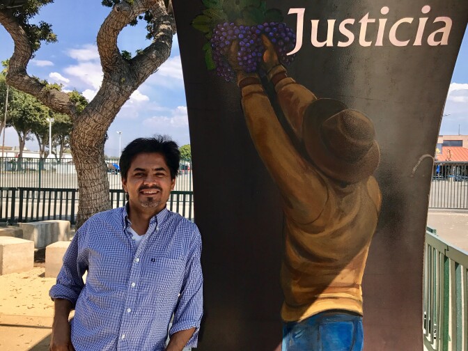 Artist Emigdio "Higgy" Vasquez's images of farmworkers adorn the inside of the portal leading to the agricultural workers memorial at the OC fairgrounds, Aug. 31, 2017. 