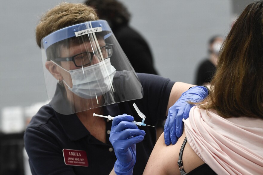 A nurse practitioner administers a dose of the Moderna Covid-19 vaccine at a clinic for Catholic school education workers including elementary school teachers and staff at a vaccination site at Loyola Marymount University (LMU) on March 8, 2021 in Los Angeles, California. (Photo by Patrick T. FALLON / AFP) (Photo by PATRICK T. FALLON/AFP via Getty Images)