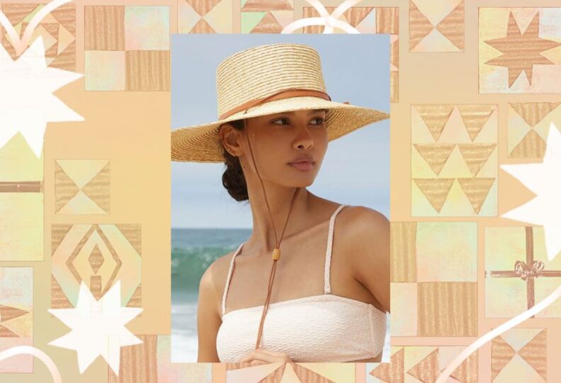 A photograph of a young woman at the beach, she is wearing a bathing suit top and looking off into the distance: She is wearing a straw hat, with a strap to keep it from flying away. The image is set against a decorative taupe background accented with stars, gift boxes and strands of ribbon.