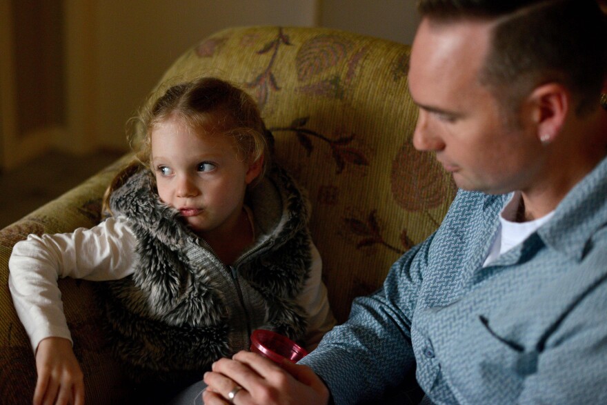 This photo taken on June 16, 2017 shows four-year-old Arielle Harding sitting on the sofa with her father Tim at their home in Newcastle, 160km north of Sydney.
Arielle Harding had her first epileptic seizure at 15-months-old. Suffering from about 100 a day, treatment with traditional drugs made things worse. Her desperate parents recently tried small doses of Cannabidiol, or CBD, a non-psychoactive marijuana derivative in liquid form and Arielle, now five, shows few signs of her condition.  / AFP PHOTO / Peter PARKS / TO GO WITH Australia-social-health-cannabis-drugs, FOCUS by Daniel DE CARTERET        (Photo credit should read PETER PARKS/AFP/Getty Images)