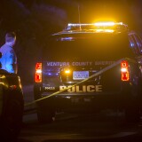 A Ventura County Sheriffs officer stands near a vehicle near the Borderline Bar and Grill, where a mass shooting occurred on November 7, 2018 in Thousand Oaks, California.