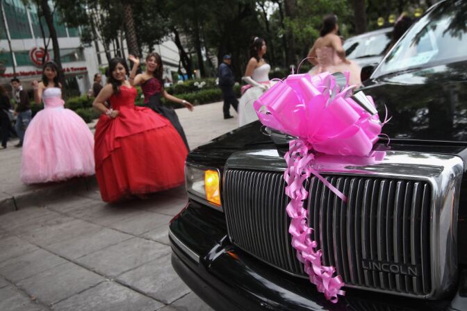 Fifteen-year-old girls return to their limousine after a photo shoot at Mexico's Angel of Independence monument on June 23, 2012 in Mexico City, Mexico. The monument is a favorite spot for photo shoots following "quinceanera" coming out parties for fifteen-year-old girls. Many wealthy families spend small fortunes on the events. Although incomes have risen nationwide in recent years, Mexico's vast income disparity is a major theme ahead of Sunday's upcoming presidential election.  