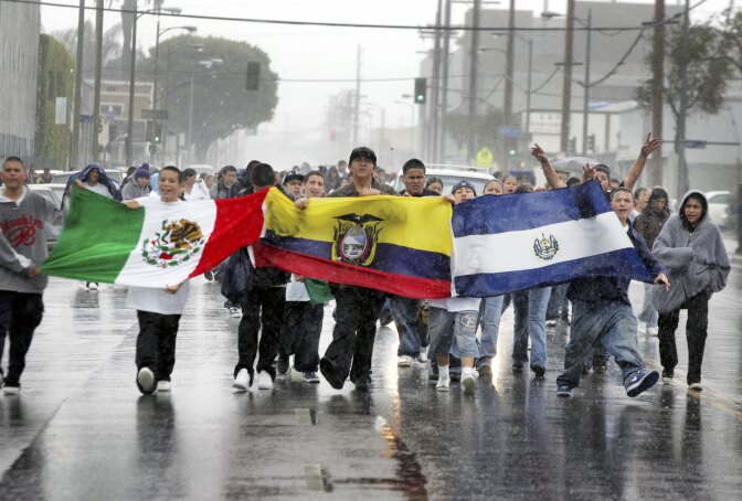 LOS ANGELES - MARCH 28:  Students march in streets carrying latin american flags to protest against a proposed immigration policy March 28, 2006 in Los Angeles, California. Reports estimated that the number of students who have walked out of classes to be around 4000. (Photo by J. Emilio Flores/Getty Images)
