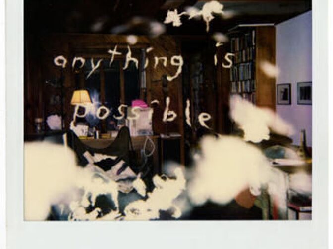 One of the "ghost writer" Polaroids communicates "anything is possible." Some believe it's the paranormal trying to communicate with those inside a home in Glassel Park. 