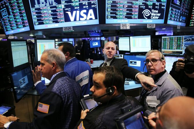 Traders work on the floor of the New York Stock Exchange. 