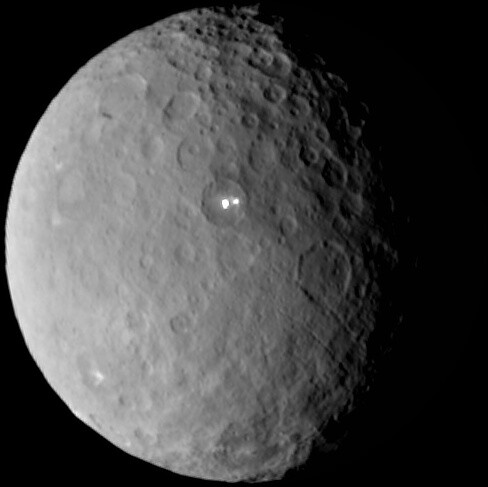 The two bright spots seen in this image captured by Dawn at a distance of 29000 miles are in the same region where the Herschel Space Observatory detected water vapor emission from Ceres's surface.  