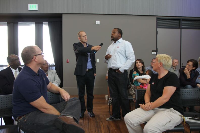 KPCC's Frank Stoltze taking a question from an attendee during Coming Home: Life For Veterans in the Southland.  