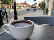 A dark hot chocolate sits on a table in Pasadena. 