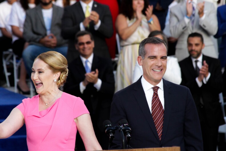 Mayor Eric Garcetti and First Lady Amy Wakeland greet the crowd for his inauguration at City Hall in Los Angeles, California on July 1, 2017.