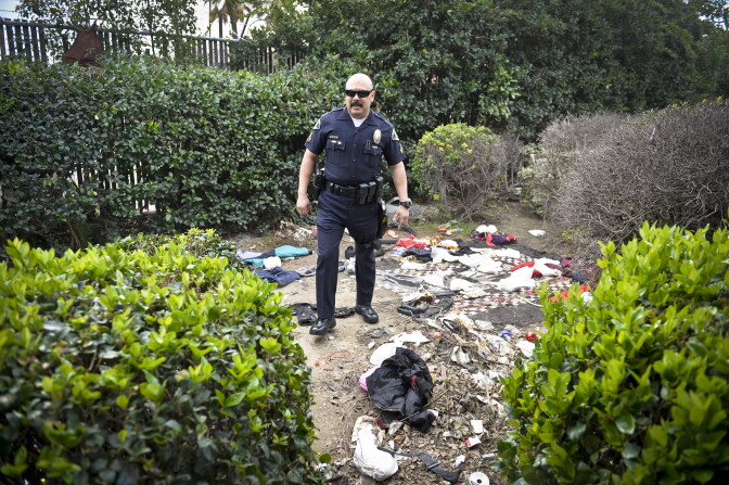 Anaheim Community Policing Team Officer Jesse Romero examines a homeless encampment on vacant property in Anaheim Thursday. 

Anaheim Police Department CPT division on patrol in Anaheim Thursday January 29th, 2014. The CPT division engages communities to reduce crime and build relationships with citizens to improve the community.Anaheim Police Department CPT division on patrol in Anaheim Thursday January 29th, 2014. The CPT division engages communities to reduce crime and build relationships with citizens to improve the community. 

