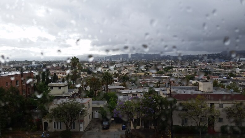 View of Hollywood from Silver Lake after light showers Saturday. An earlier storm dumped an inch of rain and a foot of snow in Northern California.