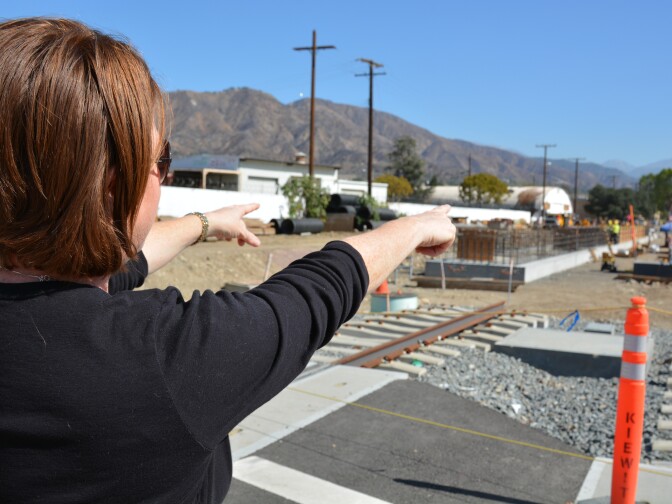Lisa Levy Buch, director of public affairs with the Gold Line Foothill Extension project, points to where a Gold Line station will be in Azusa.