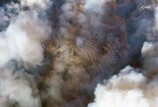 Arial photos of fire damage in residential areas, smoke billows in the sky.