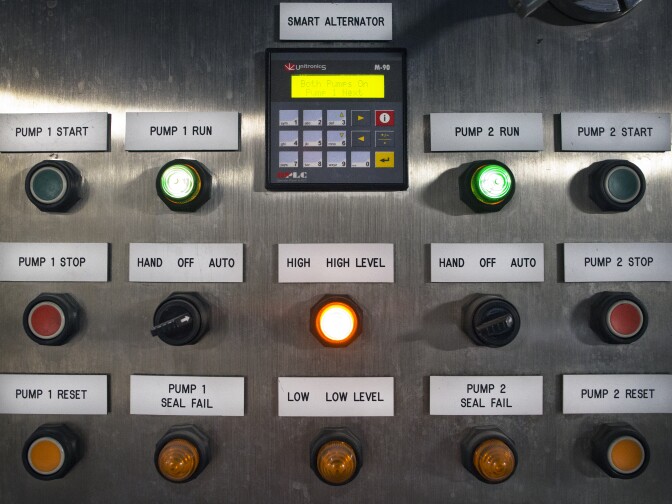 Workers use control panels in the micro-filtration area. Mirco-filtration technology was first invented by German scientists shortly after WWII.