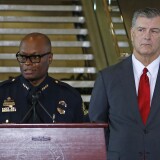 DALLAS, TX - July 8, 2016: Dallas Mayor Mike Rawlings (R) looks on during a press conference at Dallas City Hall as Dallas Police Chief David Brown speaks on the fatal shootings of five police officers on July 8, 2016 in Dallas, Texas. At least one sniper killed five officers and wounded seven others in a coordinated ambush at a anti-police brutality demonstration in Dallas. The sniper was killed, and three other people are in custody, officials said.  (Photo by Stewart  F. House/Getty Images)