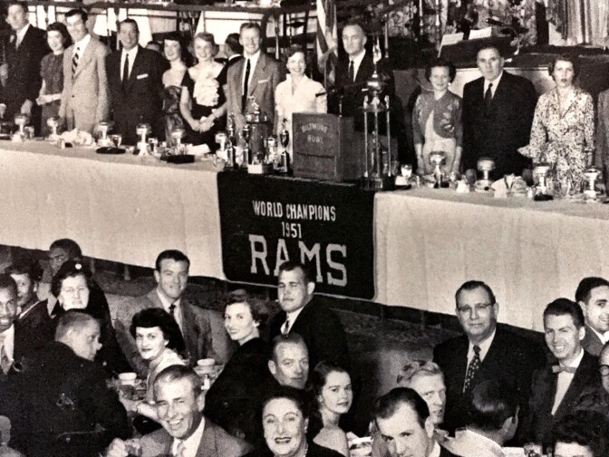 A celebratory banquet, with the Rams banner, which now hangs at Tom Bergin's, draped in front of the podium. 