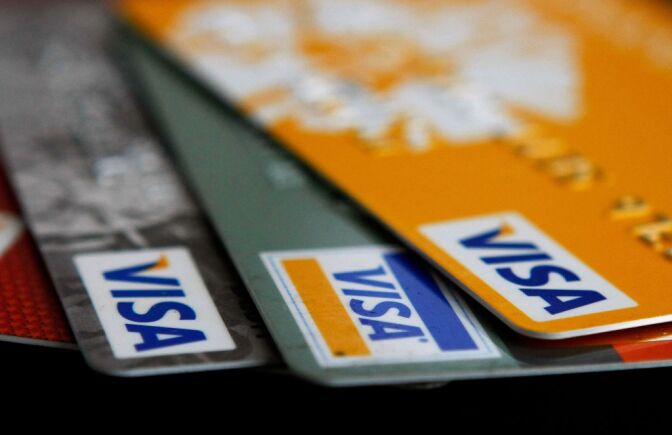 Visa credit cards are arranged on a desk February 25, 2008 in San Francisco, California. Visa Inc. is hoping that its initial public offering could raise up to $19 billion and becoming  the largest IPO in U.S. history.
