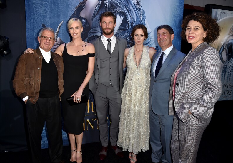 WESTWOOD, CALIFORNIA - APRIL 11: Vice Chairman of NBCUniversal Ron Meyer, actress Charlize Theron, actor Chris Hemsworth, actress Emily Blunt, Chairman of Universal Filmed Entertainment Jeff Shell and Chairman of Universal Pictures Donna Langley attend the premiere of  Universal Pictures' "The Huntsman: Winter's War" at the Regency Village Theatre on April 11, 2016 in Westwood, California.  (Photo by Kevin Winter/Getty Images)