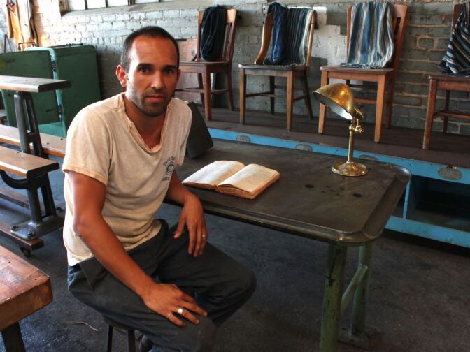 David Palos sitting at his warehouse, Irons and Duck, in Vernon.