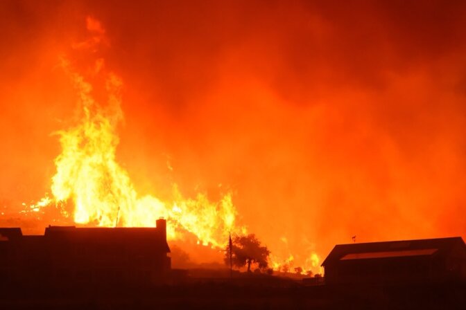 Flames advance on a two story home off Shepard Mesa Road at 5:45 a.m. on Sunday, Dec. 10, 2017 during the Thomas Fire.