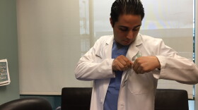 Dr. Joseph Shadpour prepares to evaluate patients in urgent care with flu symptoms.