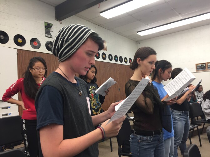 Eleventh grader Percy Ragsdale, wearing the hat, practices with the rest of the Canyon Advanced Treble Clef choir in preparation for their Winter Concert.