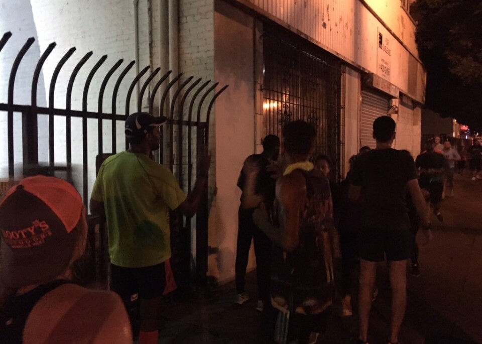 Blacklist LA pacers cheer runners to finish line. 