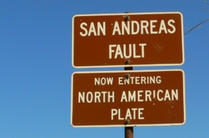 A sign marking the location of the San Andreas fault in California.