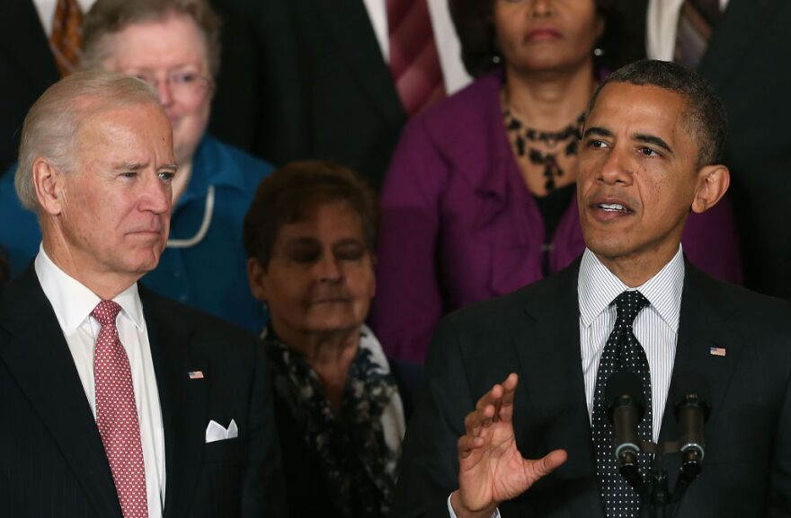 U.S. President Barack Obama (R) speaks to the media in East Room of the White House, as Vice President Joe Biden listens on November 9, 2012 in Washington, DC. President Obama said he invited Congressional Republican leaders to come to the White House to discuss ways of the avoiding the so-called fiscal cliff at the end of the year. 