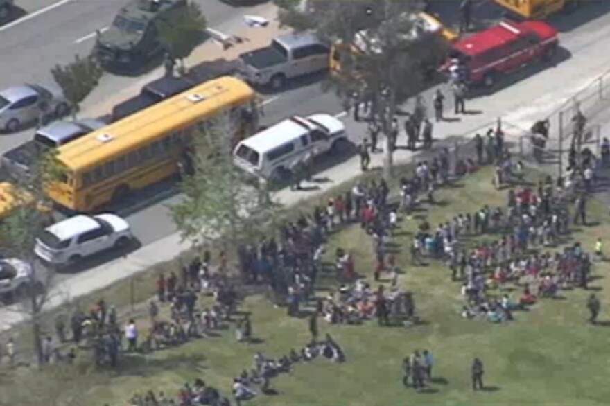 This screenshot from NBC L.A. shows students gathered outside North Park Elementary School following a shooting at the school on Monday, April 10, 2017.