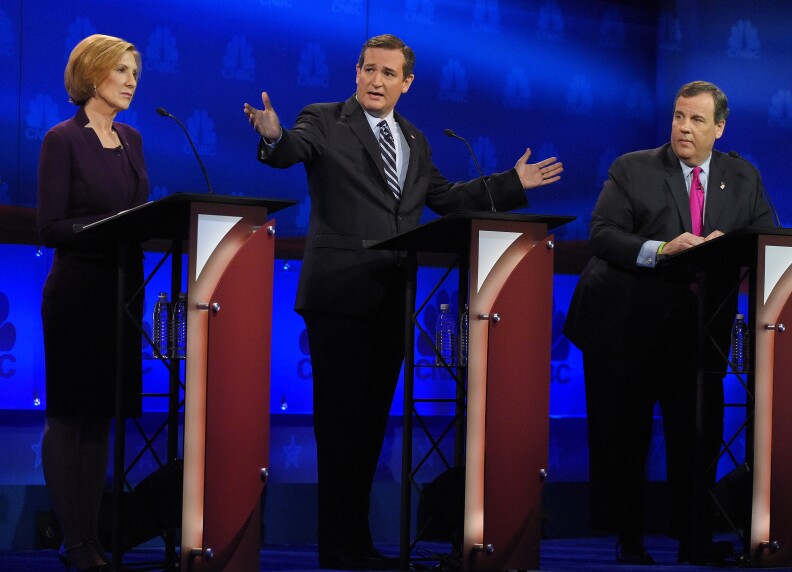 Ted Cruz, center, talks about the mainstream media as Carly Fiorina, left, and Chris Christie look on during the CNBC Republican presidential debate at the University of Colorado, Wednesday, Oct. 28, 2015, in Boulder, Colo. (AP Photo/Mark J. Terrill)