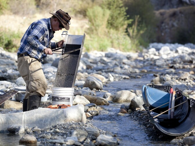 Bob Wagner prospects for gold along the San Gabriel River. Prospectors are concerned that with the San Gabriel Mountains designated a national monument, they will no longer be able to search for gold.