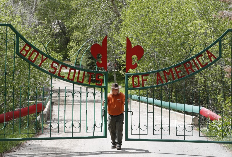 PAYSON, UT - MAY 9: Mark Veteto, Camp Ranger for the Maple Dell Scout Camp, owned by the Utah National Park Council of the Boy Scouts of America, closes the front gate for the day on May 9, 2018 outside Payson, Utah. The Utah-based Mormon Church announced that at the end of 2019 they will end their 105-year relationship with the Boy Scouts of America and drop the Boy Scout Program and replace it with their own "gospel oriented" program. This will have a severe impact on the scouting program, especially in Utah where 97 percent of the troops are sponsored by the Mormon Church. (Photo by George Frey/Getty Images)