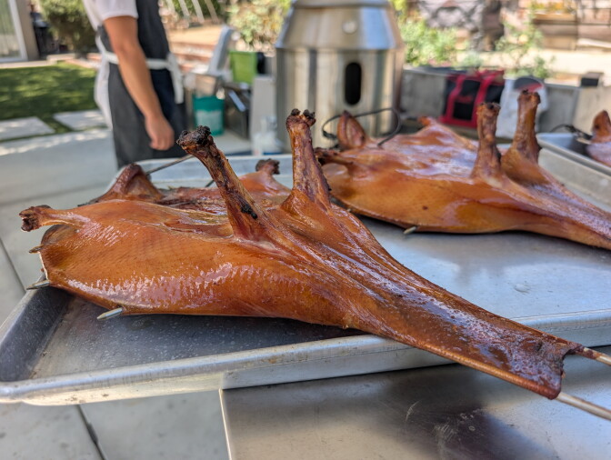 Two freshly cooked roast ducks.