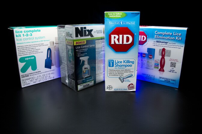 Over the counter products for controlling head lice are photographed in Washington, Monday, Nov. 4, 2013. Some parents are scratching their heads over less restrictive head lice policies that allow children with live bugs in their hair to return to the classroom for the rest of the day. Some school nurses are no longer sending home "lice notes" to parents of other children in the classroom. The policy shift is designed to help keep children from missing class, shield children with lice from embarrassment and protect their privacy.  