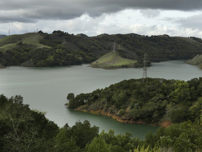 In this Wednesday, Jan. 11, 2017, photo, Briones Reservoir is seen near capacity in Orinda, Calif.  More than 40 percent of California has emerged from a punishing drought that covered the whole state a year ago, federal drought-watchers said Thursday, Jan. 12,  a stunning transformation caused by an unrelenting series of storms in the North that filled lakes, overflowed rivers and buried mountains in snow. (AP Photo/Ben Margot)