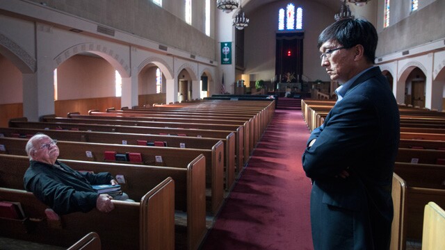 Korean War veteran Bill McInroe (seated) and Pastor John Yoon at First United Methodist Church in Riverside. 
