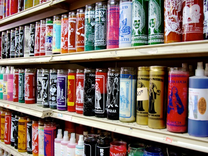 A wall of candles inside botanica on South Alvarado Street. 