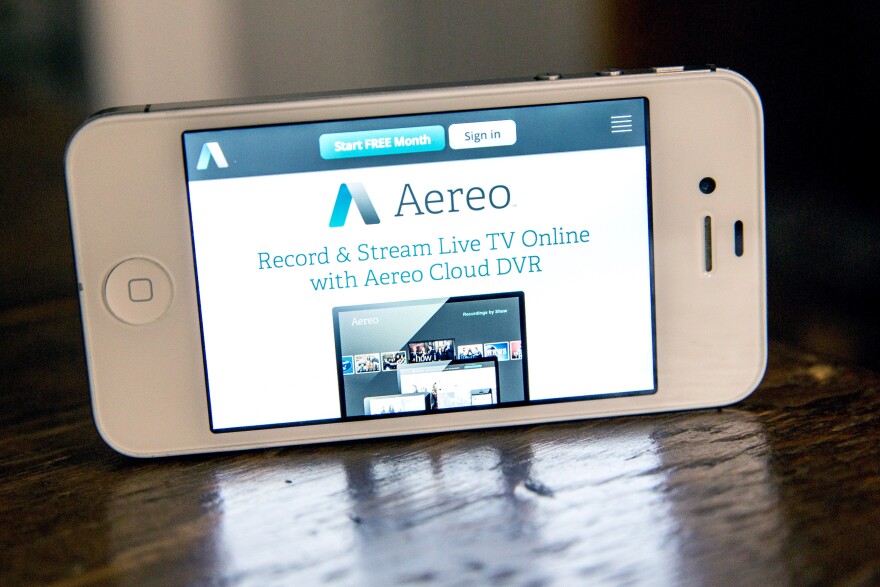In this photo illustration, Aereo.com, a web service that provides television shows online, is shown on an iPhone 4S on April 22, 2014 in New York City.