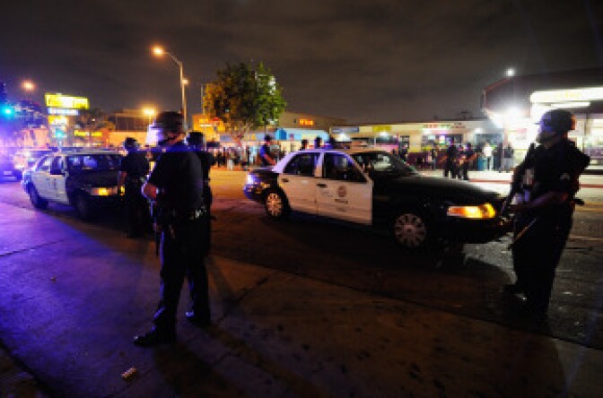 Los Angeles Police officers patrol near protesters demonstrating against the Police shooting of Guatemalan immigrant Manuel Jaminez on Sept. 8, 2010 in Los Angeles.