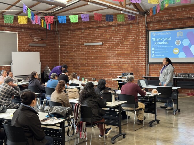 A room full of adults participate in a digital skills class led by L.A. County.