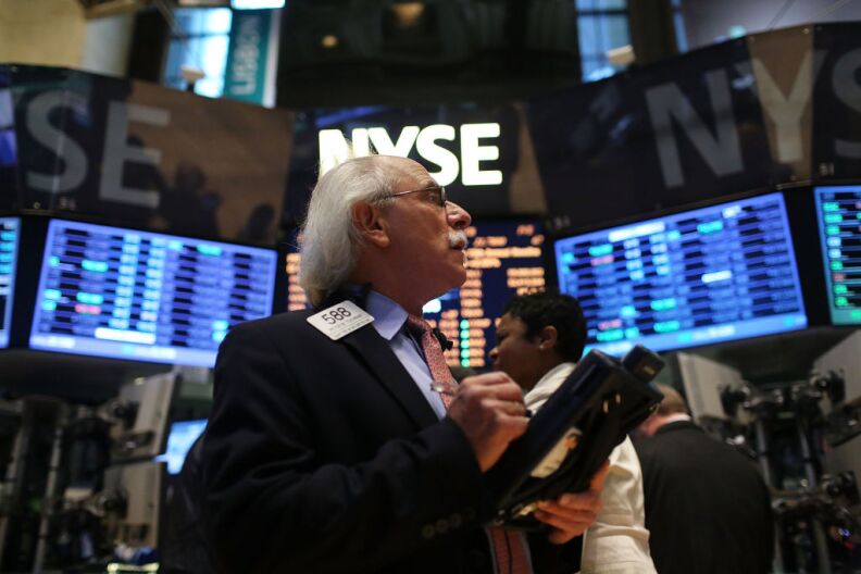 A trader works on the floor of the New York Stock Exchange on January 2, 2013 in New York City. A day after U.S. lawmakers reached a last minute agreement to avert the fiscal cliff, U.S. stocks surged as traders around the globe felt renewed confidence over global markets. Shortly after the opening bell, The Dow Jones Industrial Average rallied more than 230 points, or 1.7%. 