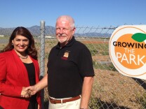 Assemblywoman Sharon Quirk-Silva (L) has introduced legislation to establish a veterans cemetery in Orange County. Bill Cook (R) wants that cemetery to be located in the Great Park (background), which was the El Toro Marine Air Base when he flew from there to Vietnam in 1968.