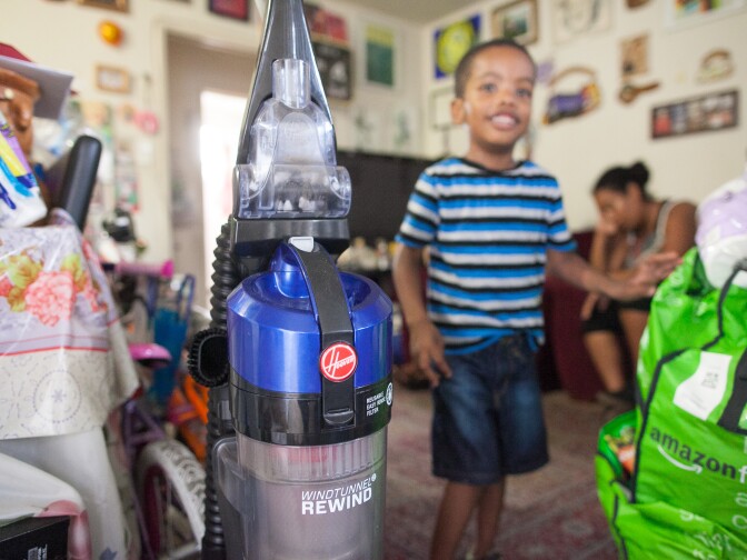 The vacuum cleaner issued to the family through a program they qualified for after Delroy Haughton, 4 was diagnosed with asthma has helped Delroy's symptoms at their apartment in Los Angeles, Calif. on Monday, Sept. 21, 2015. Delroy has asthma and his symptoms are made worse by the living conditions of his apartment.  