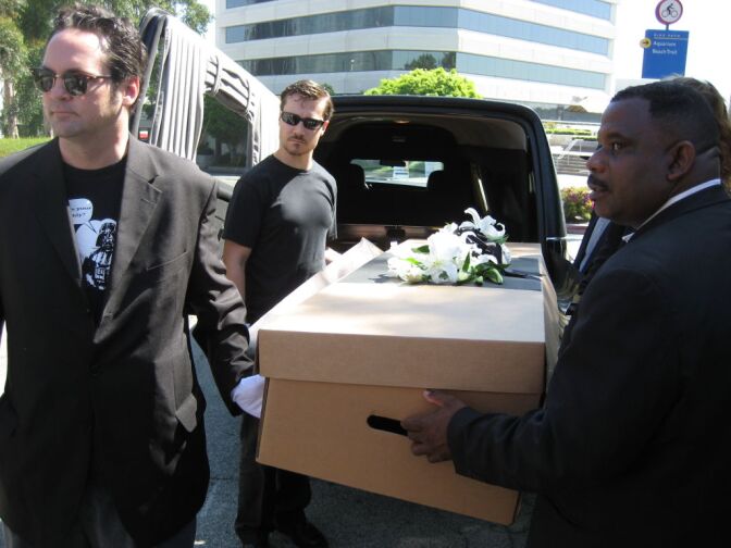 Cal State professors and students stage mock funeral for public higher education.